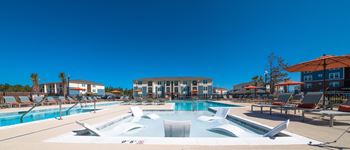 Resort style swimming pool with lap lane and sun deck